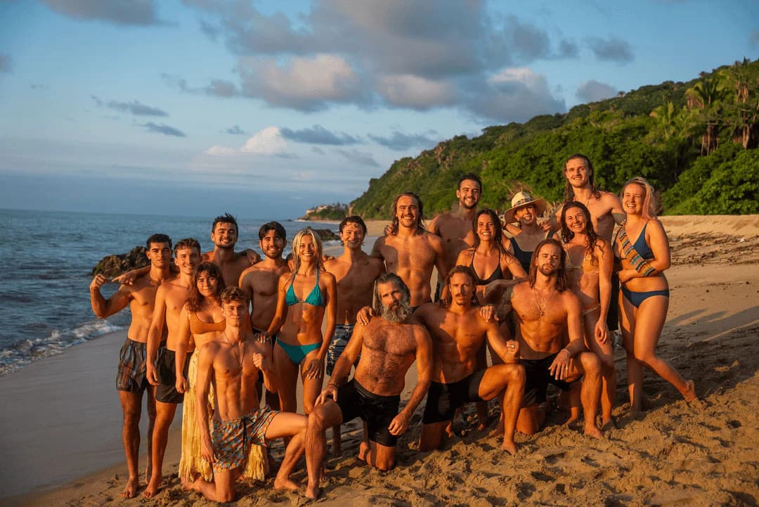 Bioculture retreat group gathered together on a beach