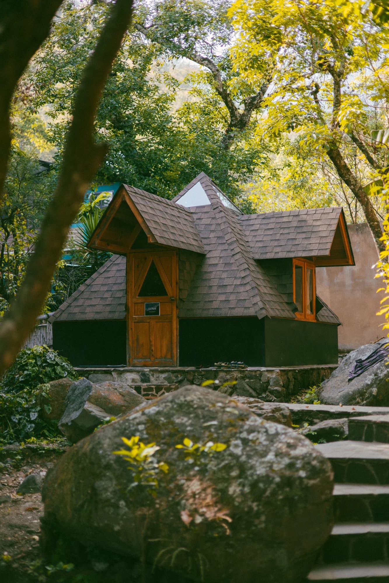 A small wood cabin tucked among the trees at Maestro Valley