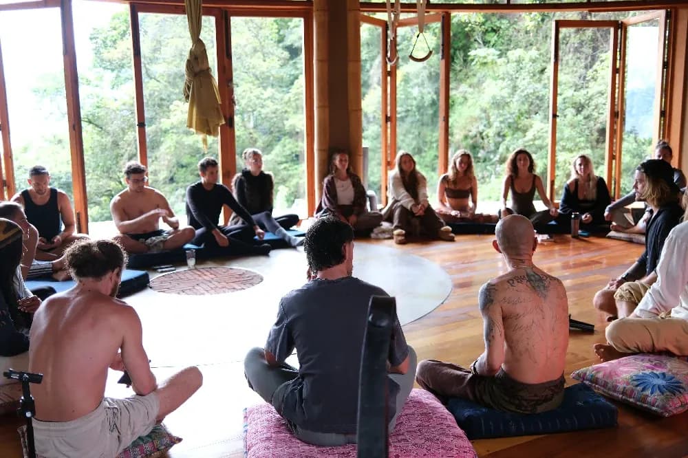 Retreat guests seated in a circle for a group learning session at Maestro Valley